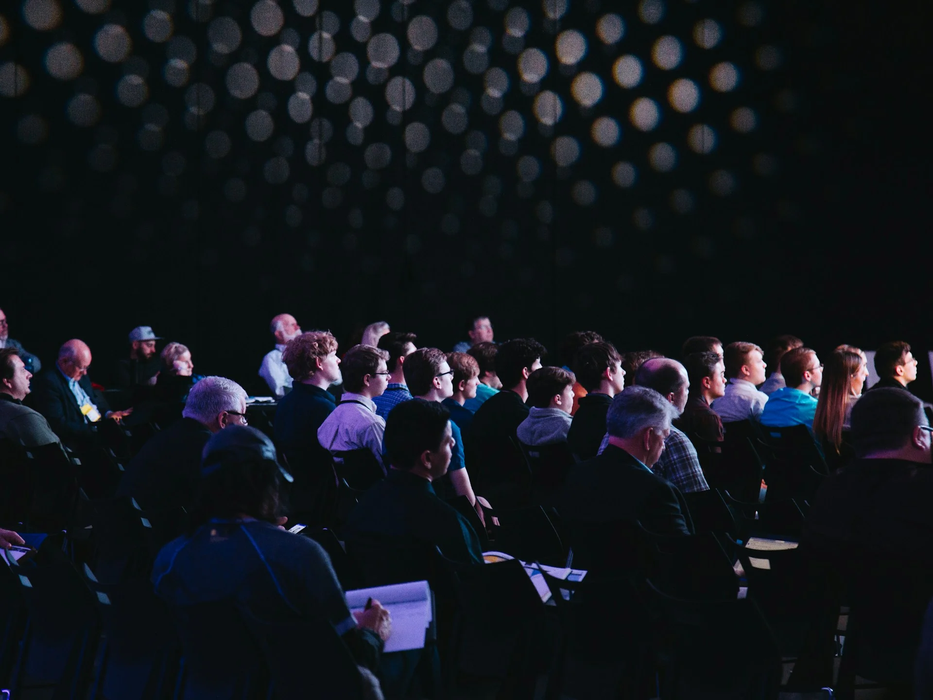 Corporate event management for businesses across Kuala Lumpur and Malaysia - Professional conference setup with staging and modern AV equipment